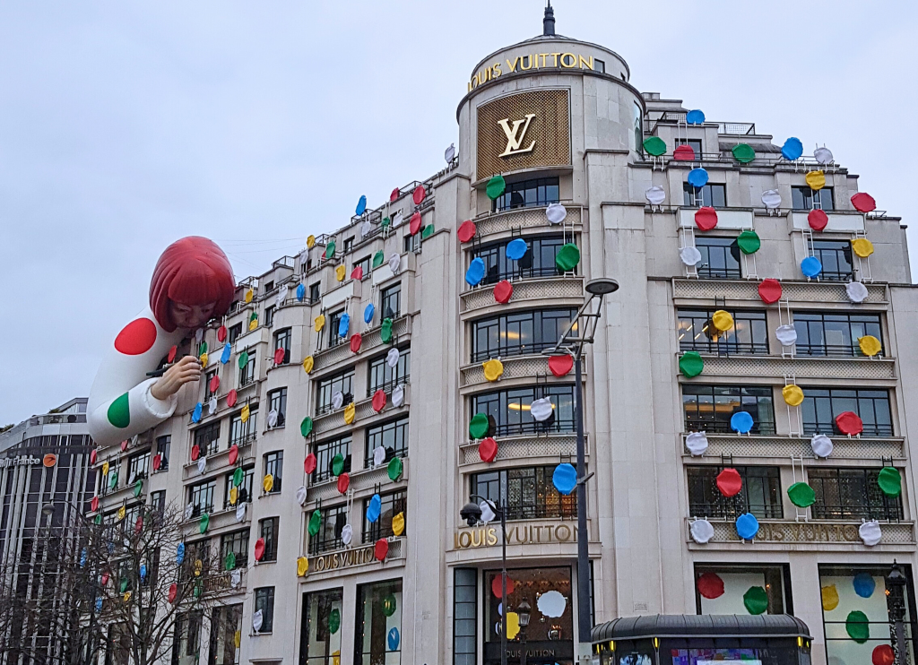 Luxury shopping in Paris Louis Vuitton Store Doll on the Building