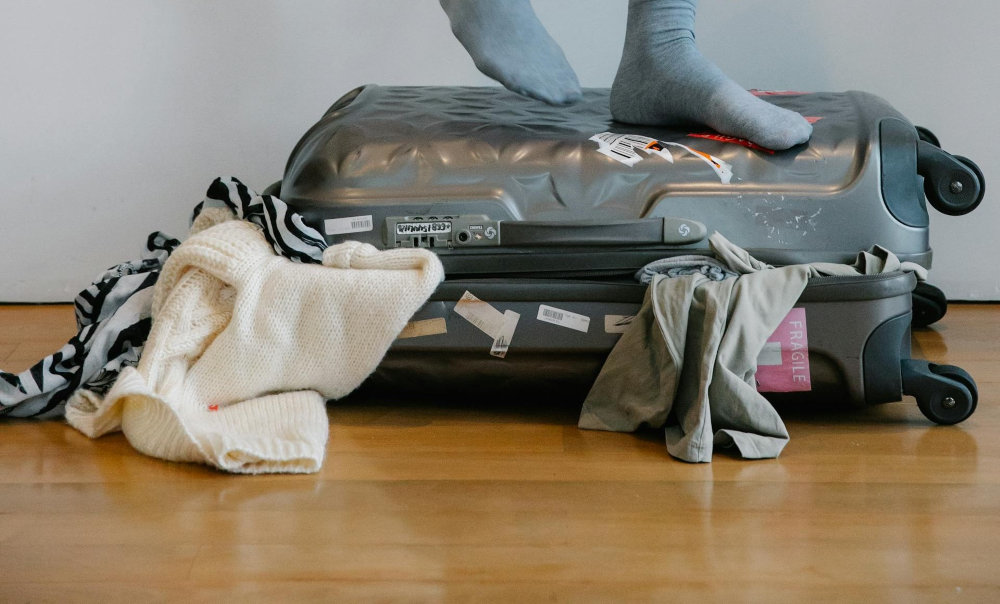 Standing on a suitcase