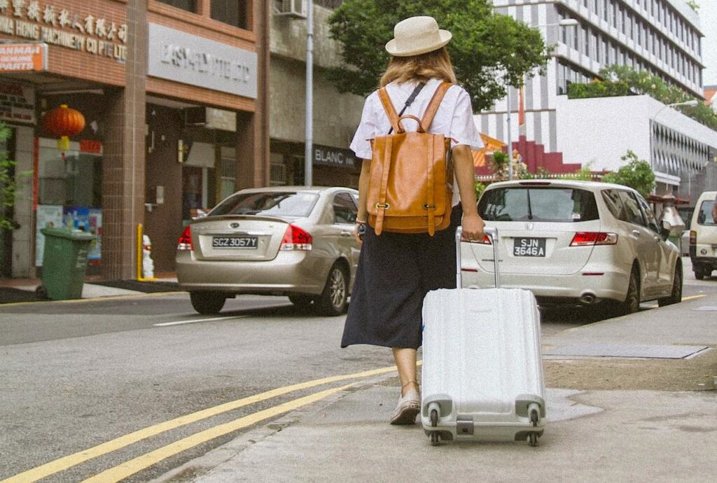 Girl Walking With Suitcase Street Cars